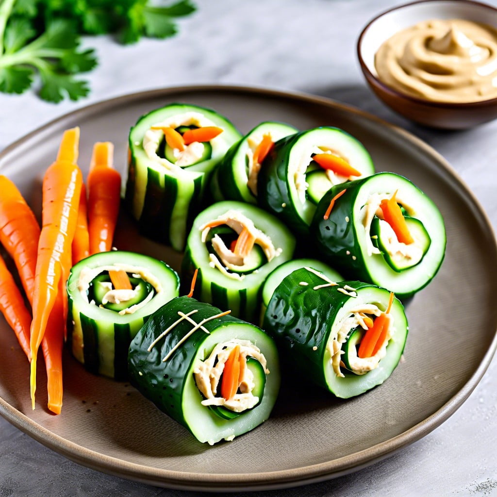 cucumber rolls with hummus and shredded carrots
