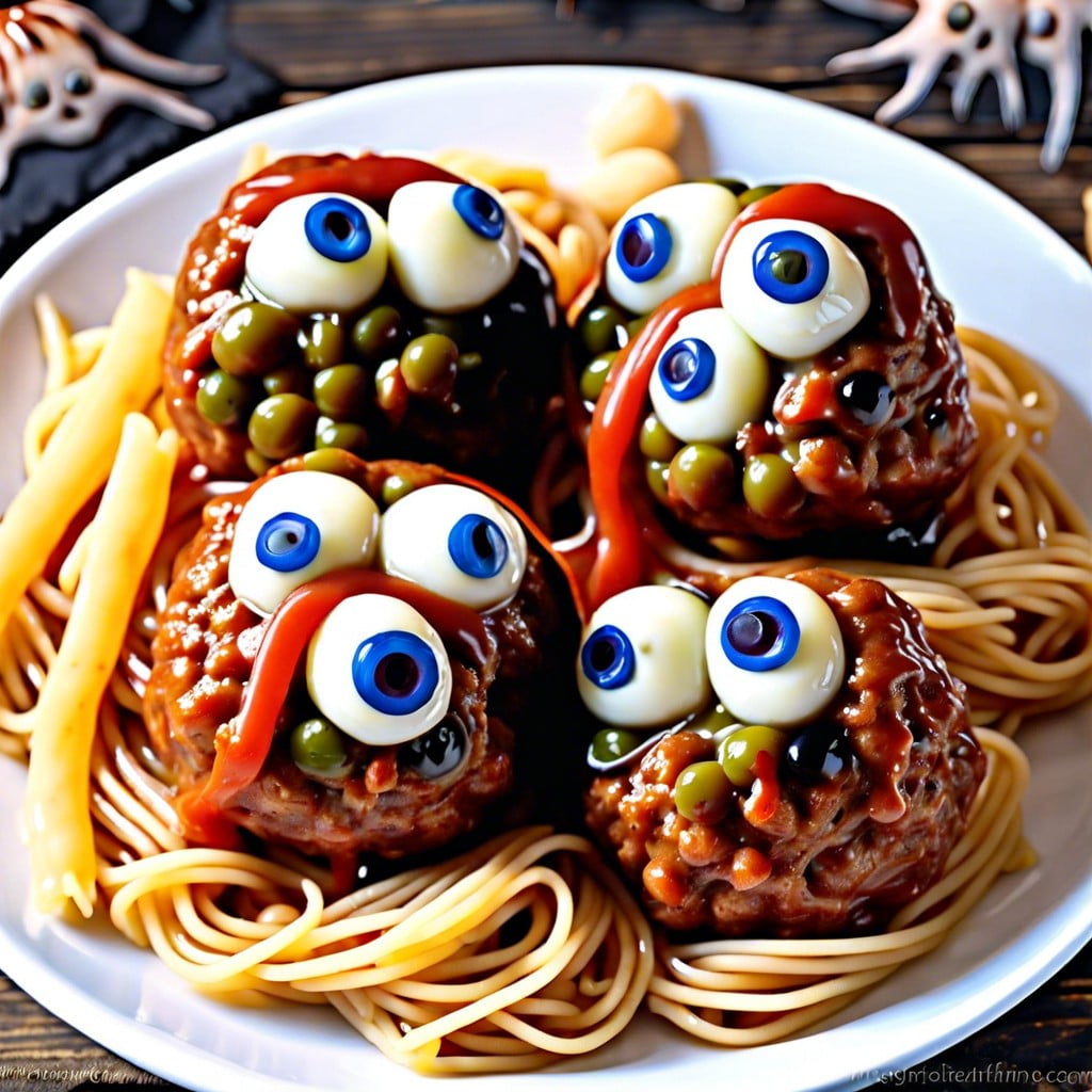 eyeball pasta serve spaghetti with meatballs mozzarella and olives as eyeballs