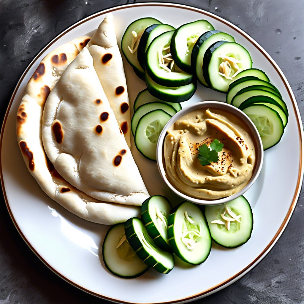 naan with hummus and cucumber slices