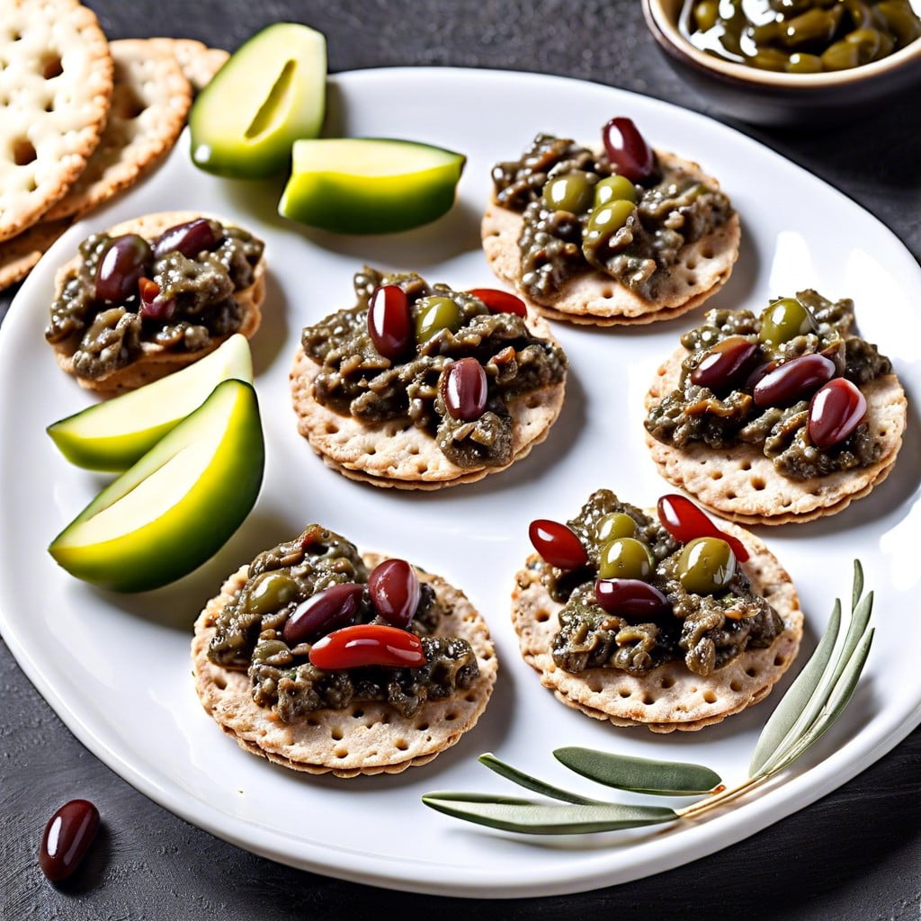 olive tapenade on whole grain crackers