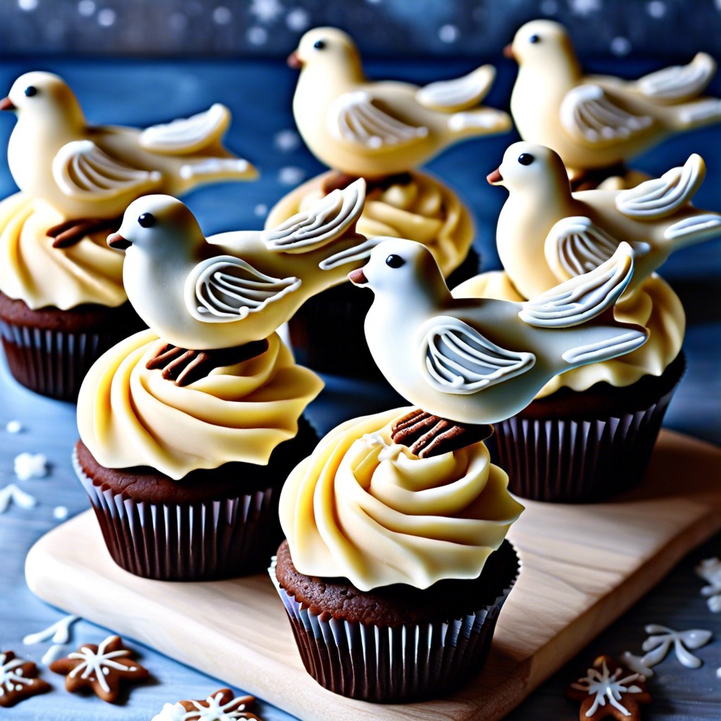 dove cupcakes white frosted cupcakes topped with a dove shaped cookie