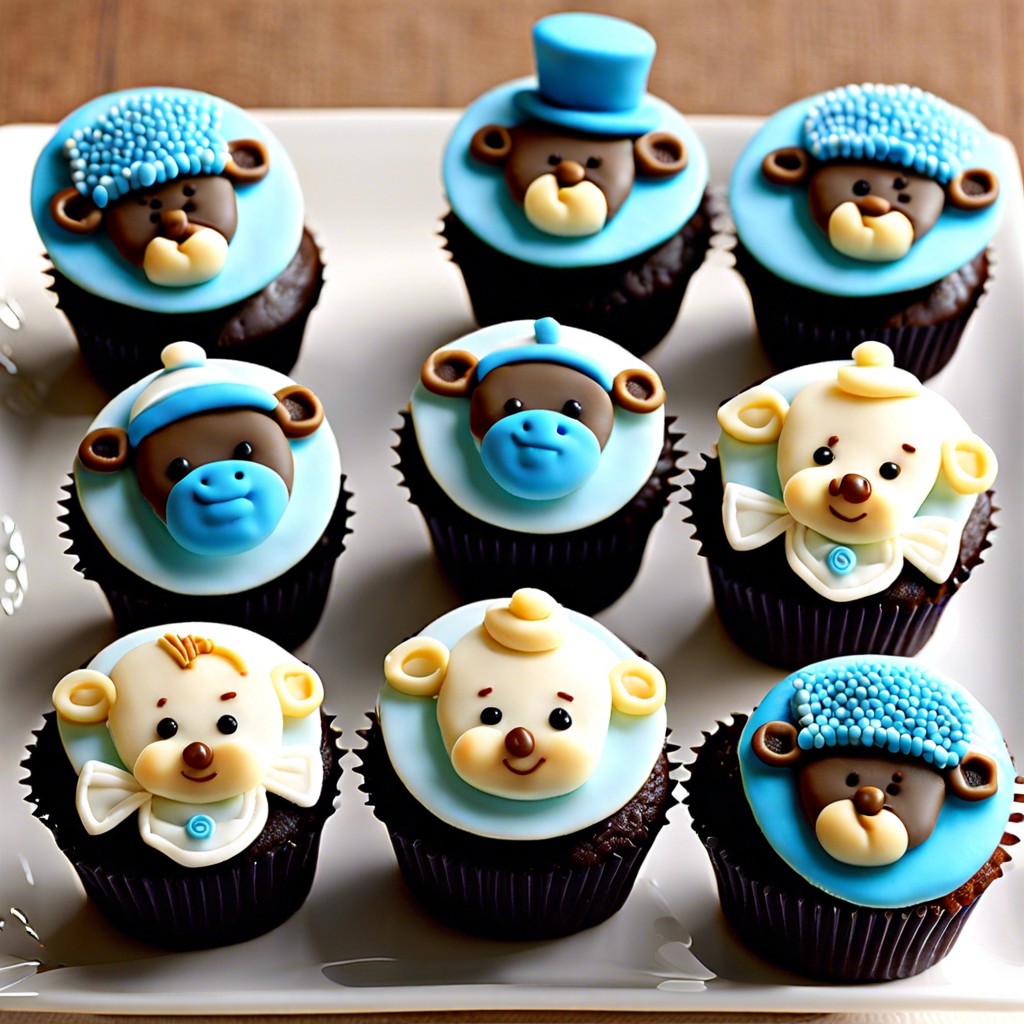 mini baby boy cupcakes with assorted toppings